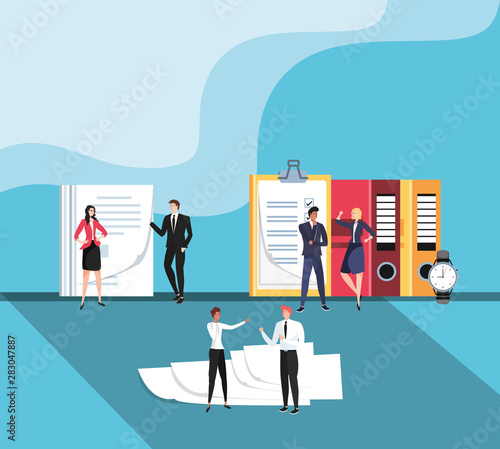 mini business people with documents in the workplace