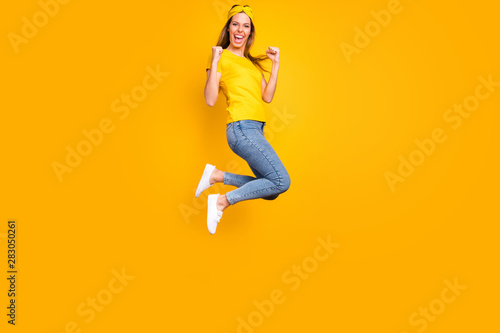 Full length photo of beautiful lady jumping high got first place wear casual clothes isolated yellow background