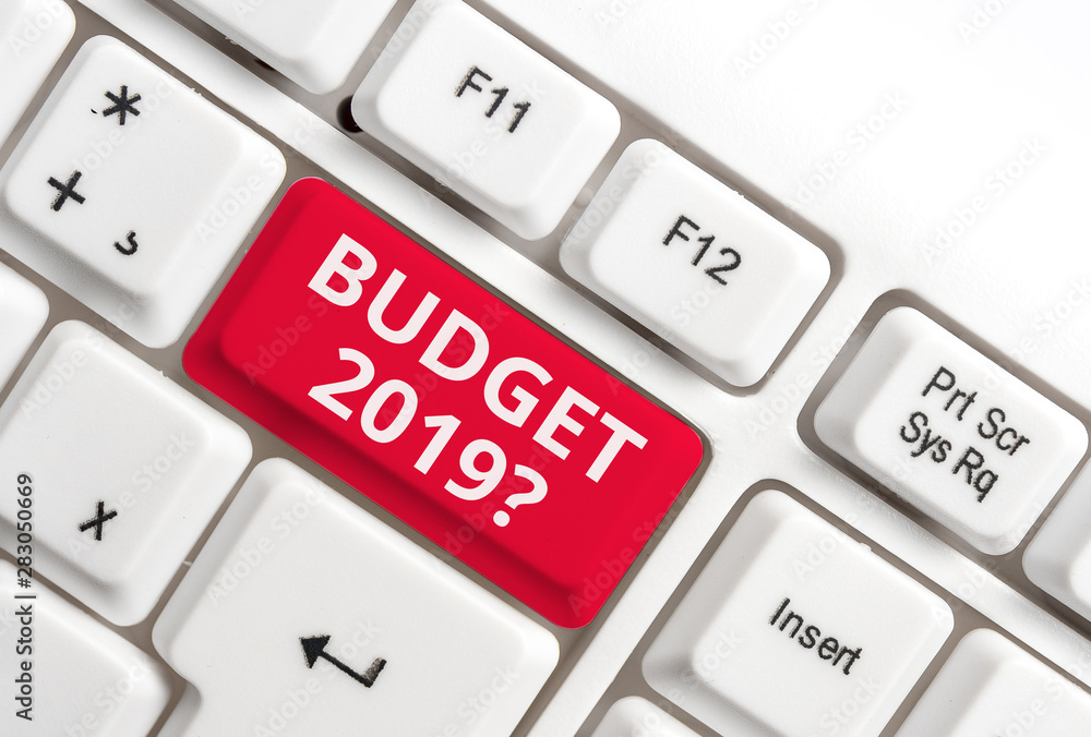 Word writing text Budget 2019 Question. Business photo showcasing estimate of income and expenditure for next year White pc keyboard with empty note paper above white background key copy space Word writing text Budget 2019 Question. Business photo showcasing estimate of income and expenditure for next year White pc keyboard with empty note paper above white background key copy space