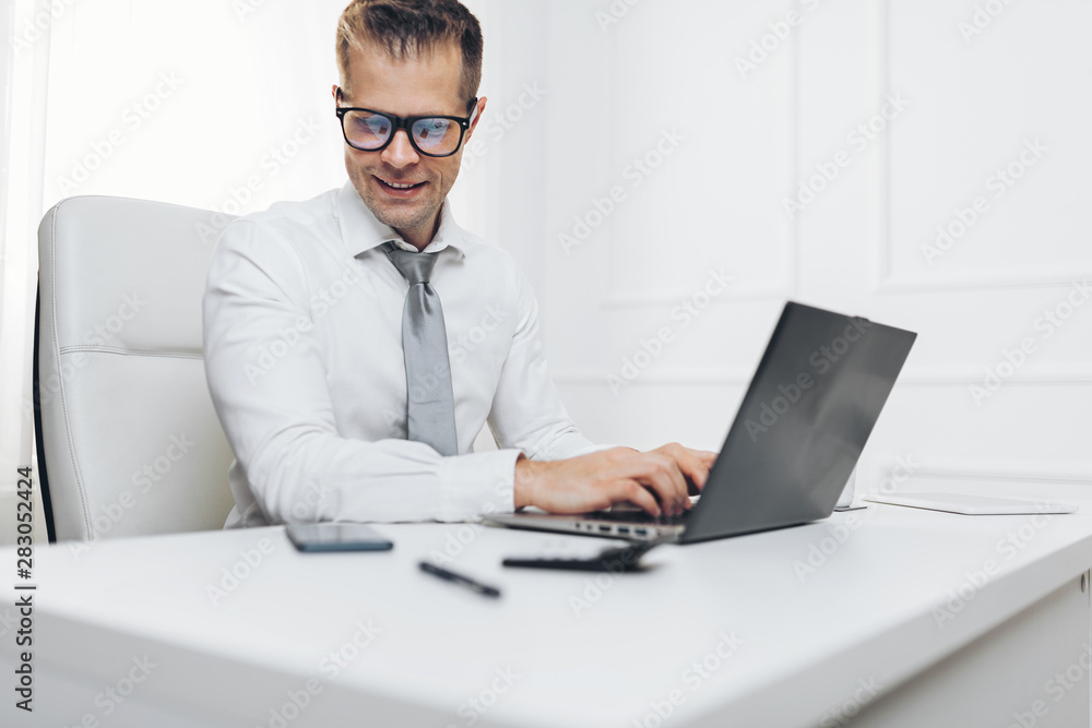 Successful businessman working in his office Successful businessman working in his office