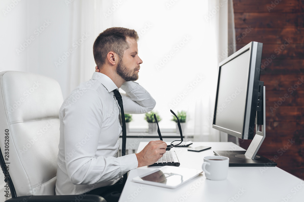 Office worker with pain from sitting at desk all day Office worker with pain from sitting at desk all day