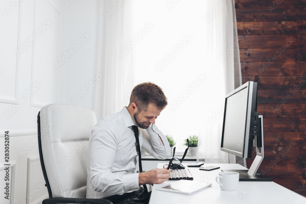 Office worker with pain from sitting at desk all day Office worker with pain from sitting at desk all day