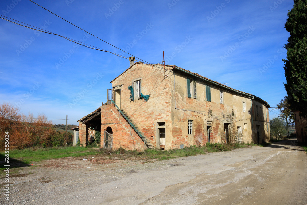 An old abandoned rural house in Italy in a sunny day