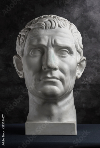 Принти на полотні Gypsum copy of ancient statue Augustus head on dark textured background