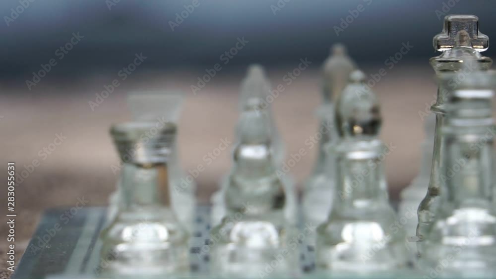 The concept of business competition: Close-up of glass chess footage slow motion