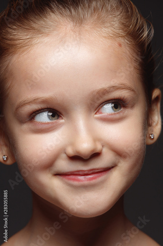 Close up portrait of little and emotional caucasian girl. Highly detail photoshot of female model with well-kept skin and bright facial expression. Concept of human emotions. Thoughtful, thinking.