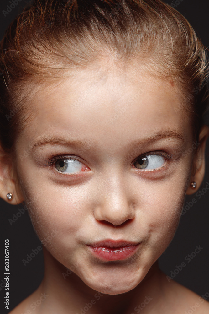 Close up portrait of little and emotional caucasian girl. Highly detail photoshot of female model with well-kept skin and bright facial expression. Concept of human emotions. Playful gremaces. Close up portrait of little and emotional caucasian girl. Highly detail photoshot of female model with well-kept skin and bright facial expression. Concept of human emotions. Playful gremaces.