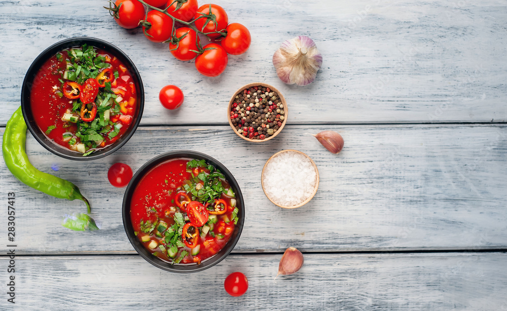 Traditional spanish cold tomato soup gazpacho on wood background