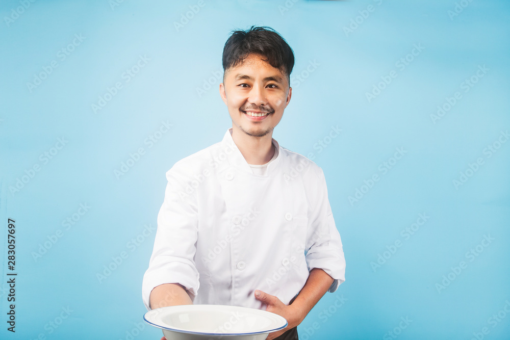 An Asian male chef,Gray background An Asian male chef,Gray background