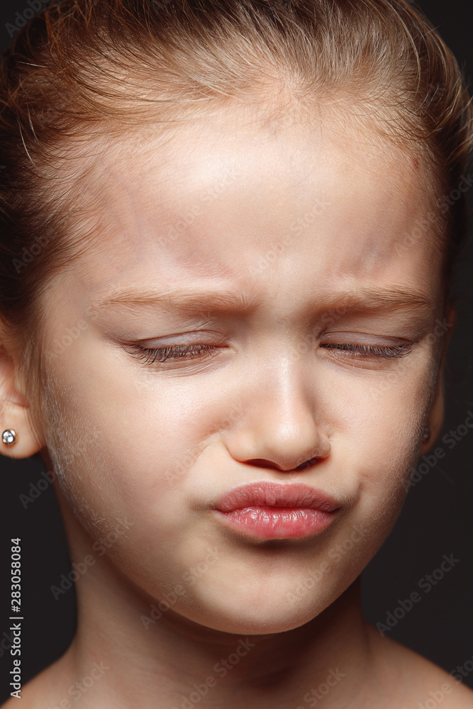 Close up portrait of little and emotional caucasian girl. Highly detail photoshot of female model with well-kept skin and bright facial expression. Concept of human emotions. Disgusting. Close up portrait of little and emotional caucasian girl. Highly detail photoshot of female model with well-kept skin and bright facial expression. Concept of human emotions. Disgusting.