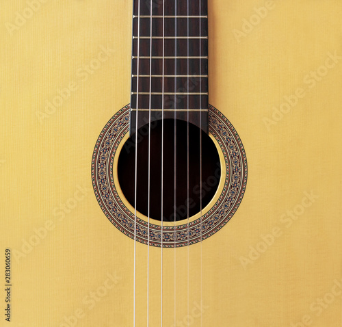 Fotografie Abstract background Wooden Spanish classic guitar hole with nylon string on