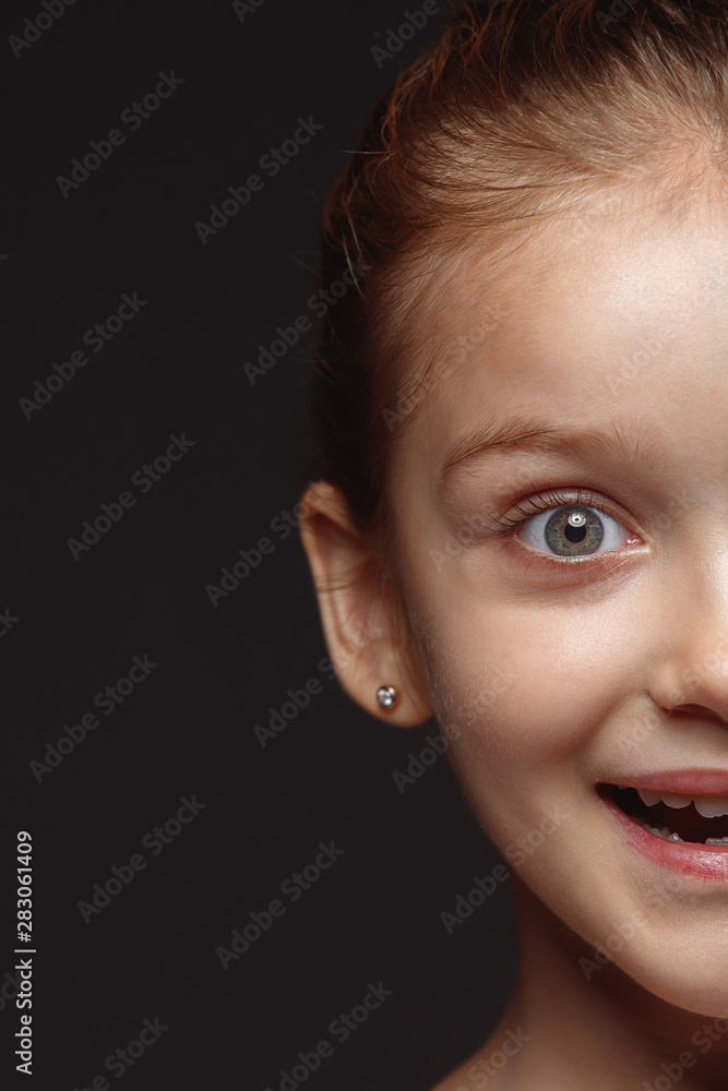 Close up portrait of little and emotional caucasian girl. Highly detail photoshot of female model with well-kept skin and bright facial expression. Concept of human emotions. Smiling, laughting. Close up portrait of little and emotional caucasian girl. Highly detail photoshot of female model with well-kept skin and bright facial expression. Concept of human emotions. Smiling, laughting.