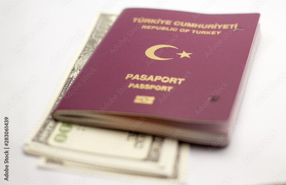 Turkish passport, dollar and pocket watch Turkish passport, dollar and pocket watch