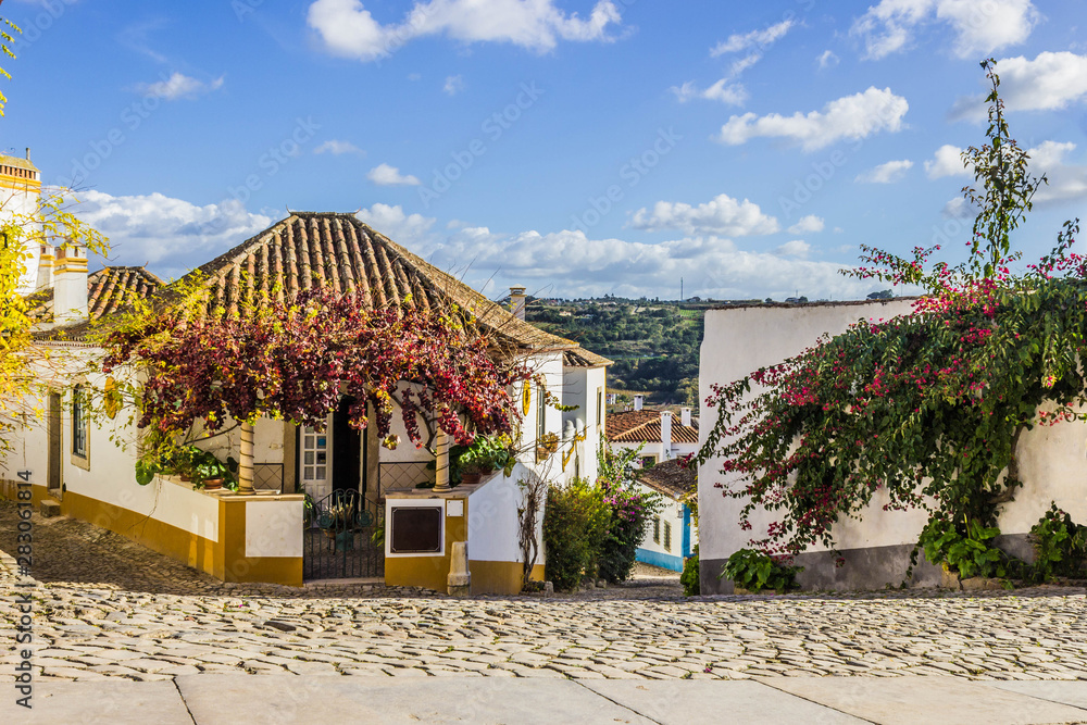 Street view at medieval and colorful city of Obidos, Portugal