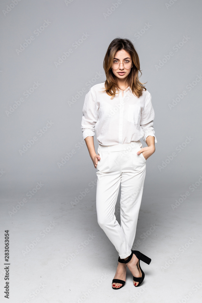 Full length portrait of a smiling pretty woman isolated over white background Full length portrait of a smiling pretty woman isolated over white background