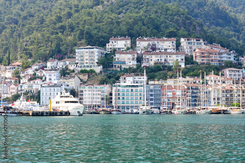 June 17, 2019 Fethiye, Turkey - Cascaded houses on a mountain in a bay