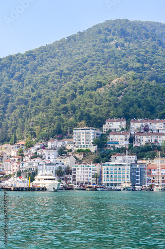 June 17, 2019 Fethiye, Turkey - Cascaded houses on a mountain in a bay