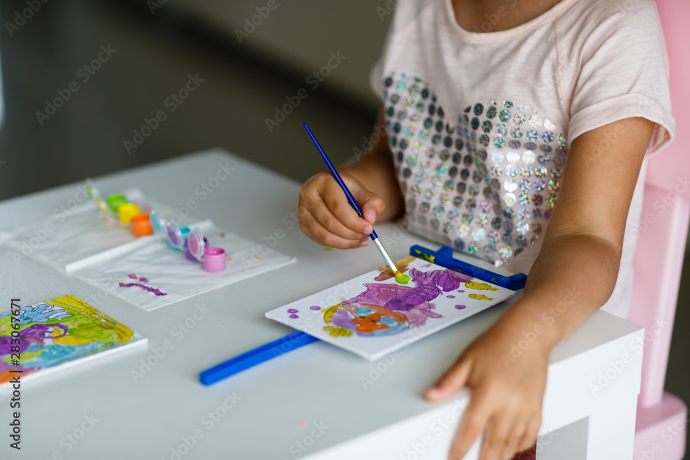 Cute Little Girl with blonde hair Painting Picture at home. Back to school, education, homeschool concept Cute Little Girl with blonde hair Painting Picture at home. Back to school, education, homeschool concept