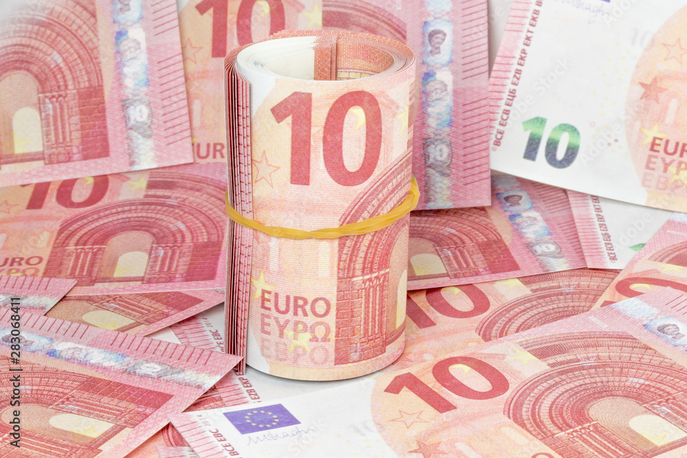rolled 10 euro with euro background rolled 10 euro with euro background