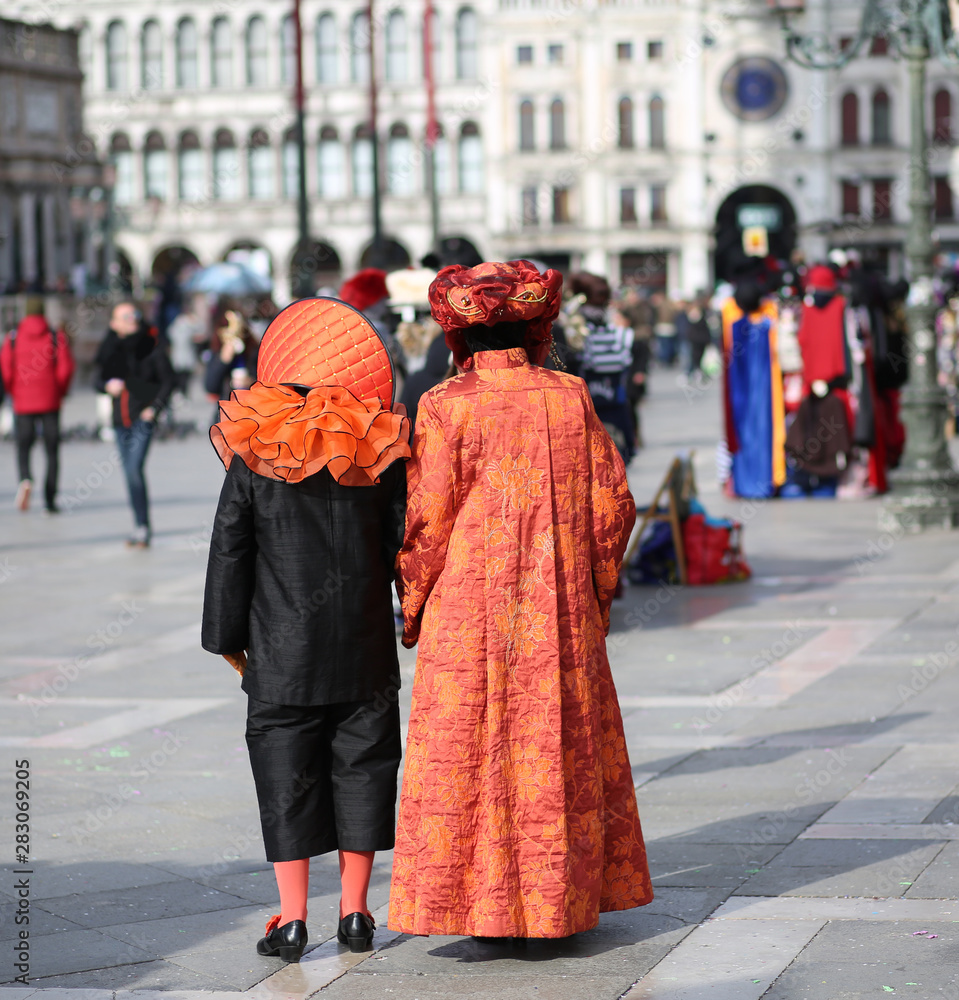 People masked during the Carnival party in Piazza San Marco in V