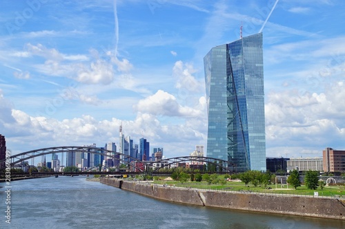 view of the river Main with the headquarters of ECB and the skyline of Frankfurt. European Central Bank and Skyscraper buildings in Germany with blue sky background. Business and finance concept