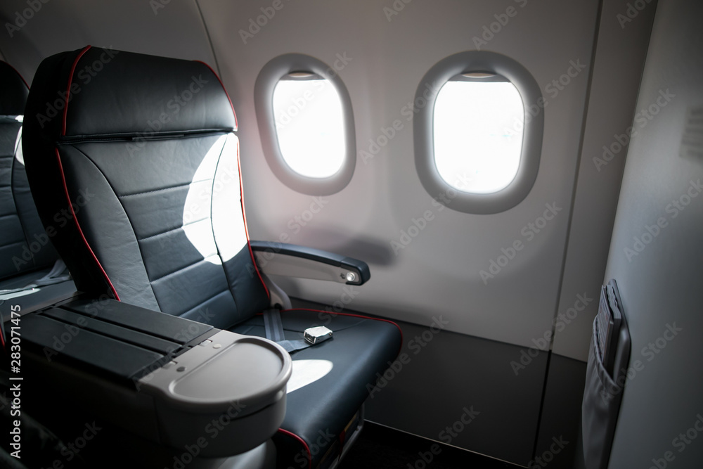 Airplane cabin seats with passengers. Economy class of new cheapest low-cost airlines without delay or cancellation of flight.