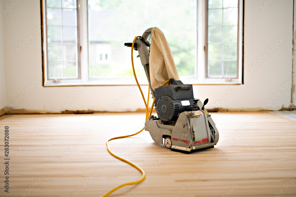 Sanding hardwood floor with the grinding machine only tool - obrazy, fototapety, plakaty 