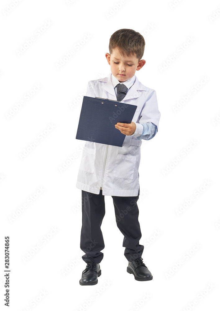Little boy wearing lab coat making notes in clipboard on white background Little boy wearing lab coat making notes in clipboard on white background