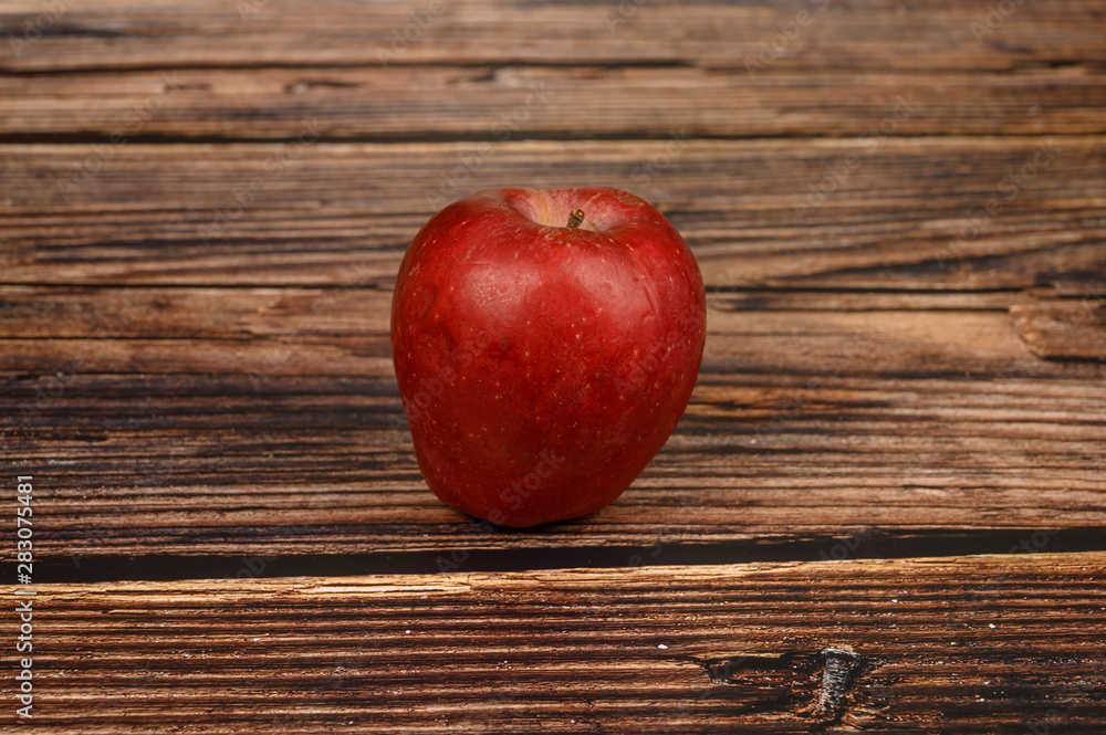 Ripe red Apple on wooden table background Ripe red Apple on wooden table background
