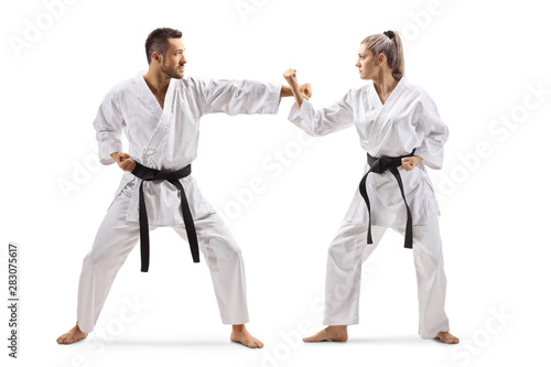 Man and woman practicing karate