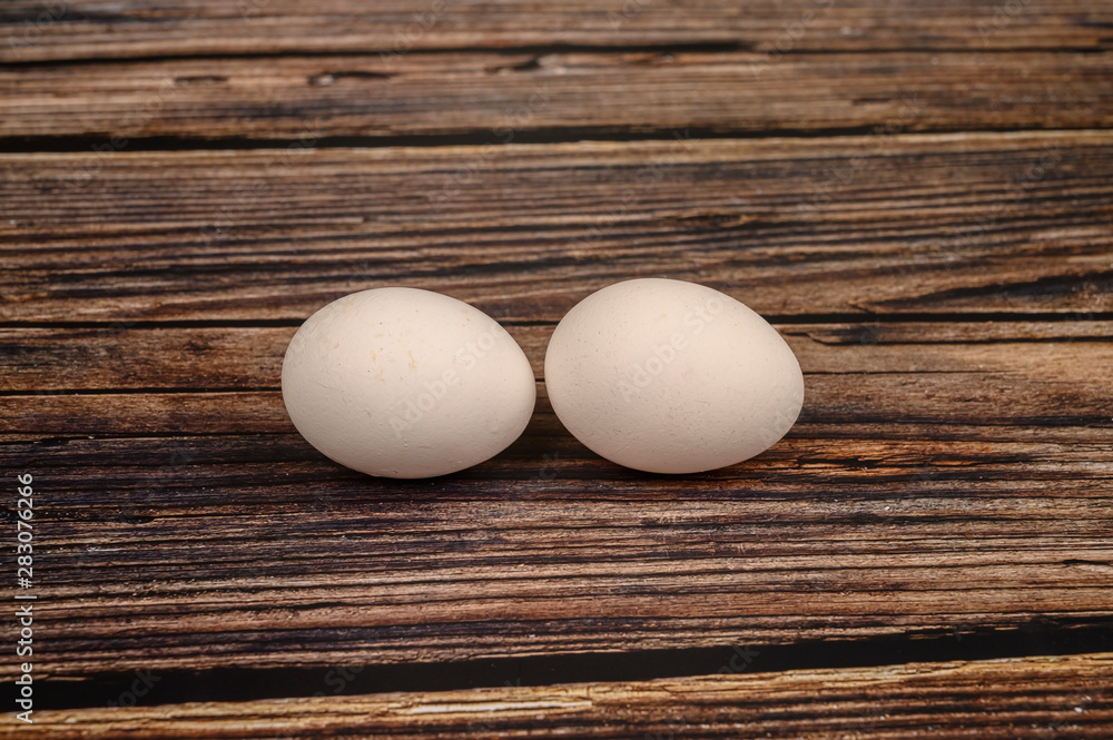 Chicken egg on wooden table background. close up Chicken egg on wooden table background. close up