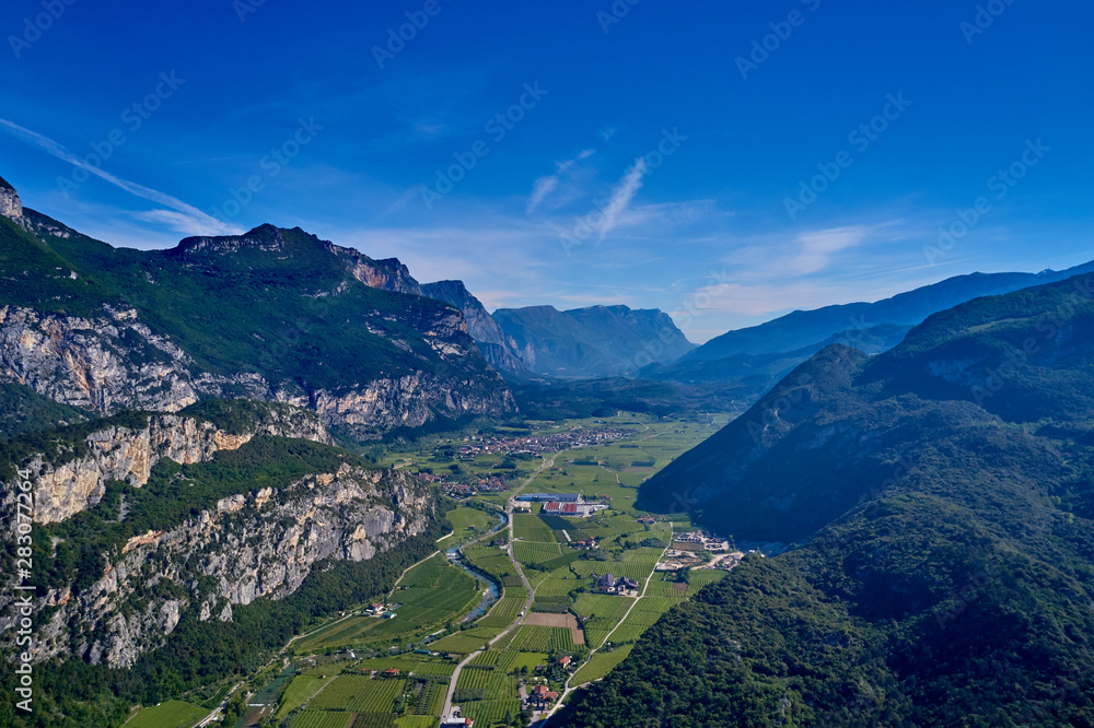 Aerial view of Lake Garda, mountains, cliffs and the city of Riva del Garda, Italy.