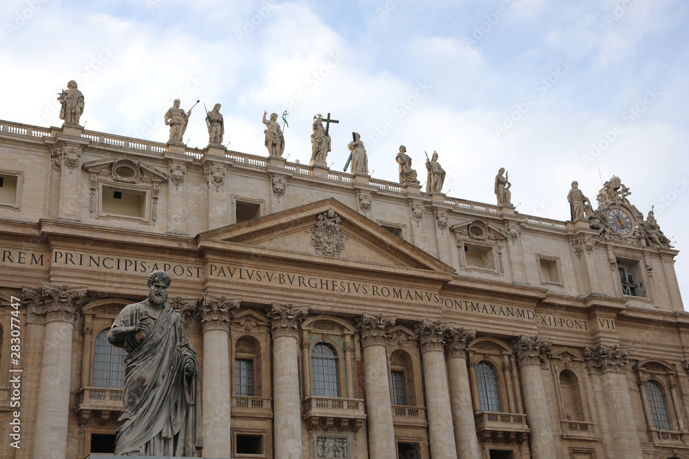Wide Basilica of St Peter in Vatican City and the Statue of Sain