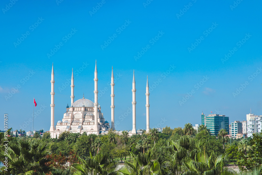 Sabanci Central Mosque in Adana city of Turkey with Seyhan River and Trees. Mosque, Seyhan river and trees at Adana town in sunny day with blue clean sky.