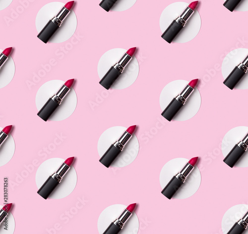 Pink lipstick seamless pattern on creative pastel pink background.