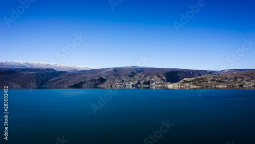Mountains with blue lake in the foreground 