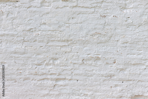Old white whitewashed brick wall