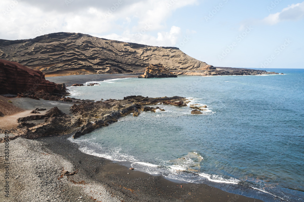 Black sand beach on the rocky point of El Golfo on the island of Lanzarote - Lanzarote, Spain