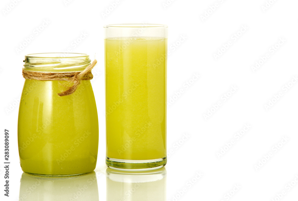 Fresh cocktail on isolate. A glass and a can with vegetable cocktails. Healthy drinks. Fresh cocktail on isolate. A glass and a can with vegetable cocktails. Healthy drinks.
