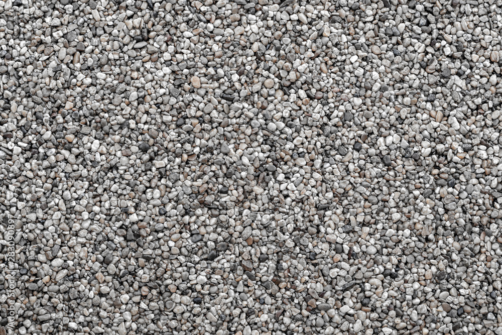 Gray stone texture. Frame filled with small round stones glued with resin. Gray stone texture. Frame filled with small round stones glued with resin.