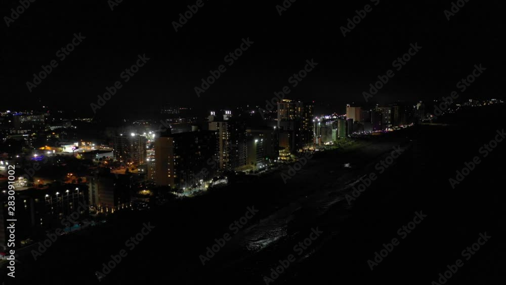 Waves crashing on the beach at night. Myrtle Beach aerials Waves crashing on the beach at night. Myrtle Beach aerials