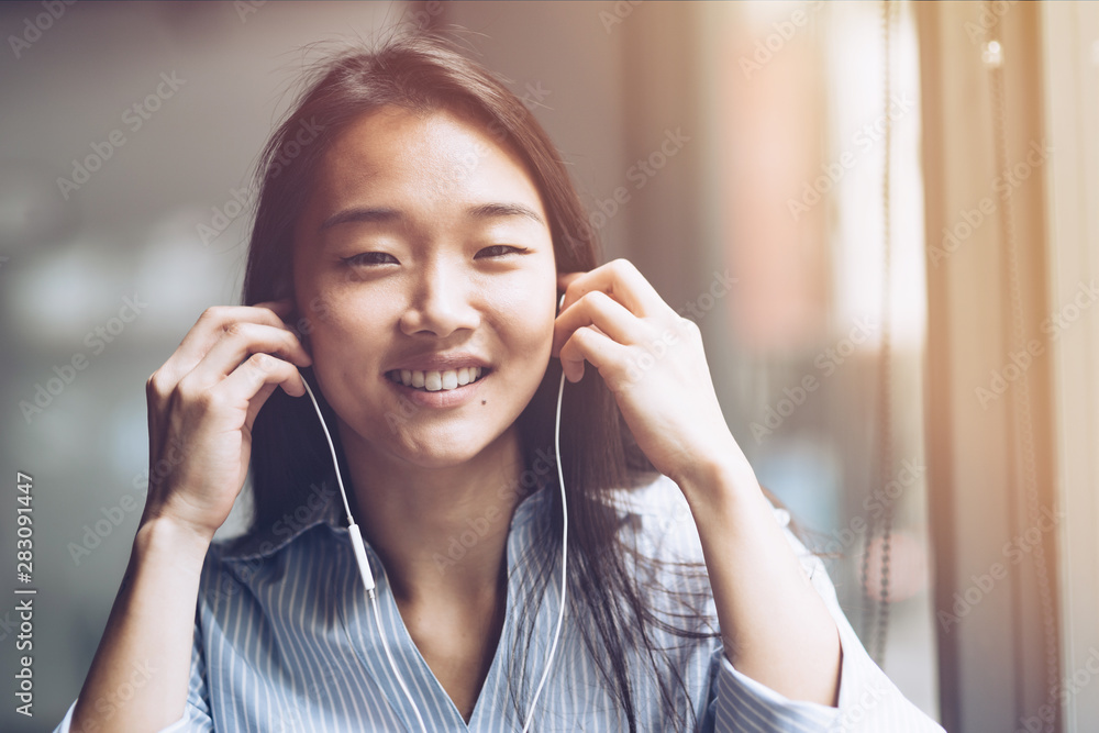 Allow yourself to relax. Happy girl working at a coffee shop. Concept of female freelancer business. Copy space on the right side Allow yourself to relax. Happy girl working at a coffee shop. Concept of female freelancer business. Copy space on the right side