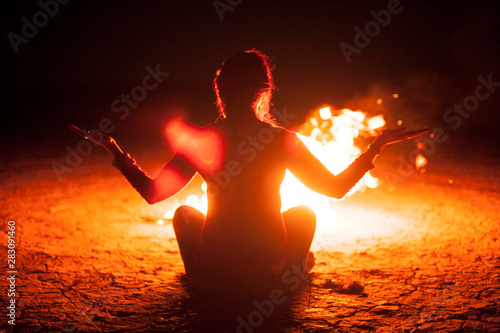 Tela Woman Meditating With A Fire