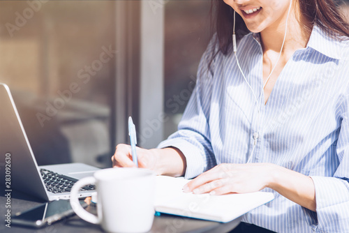 Be productive. Cheerful girl working outdoors. Concept of female freelancer business. Copy space on the left side photo