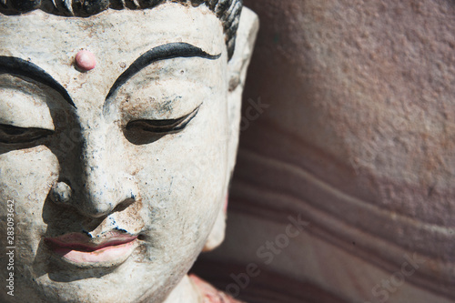 Sandstone Buddha. Buddhist bust with southwestern rock. 