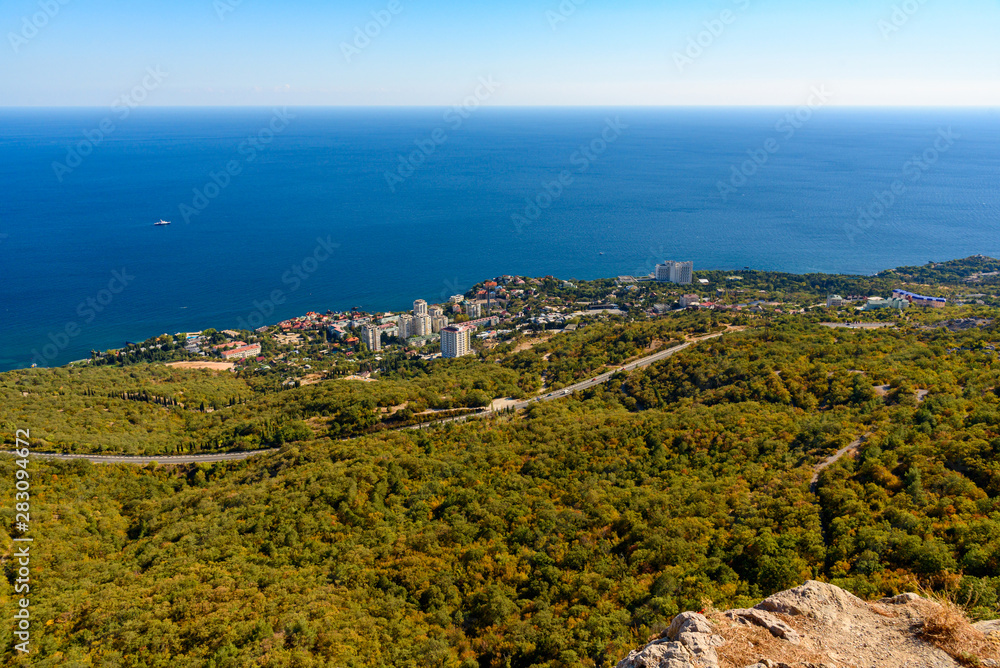 view of the Black Sea city of Foros from the height of the mountain, on a bright sunny cloudless day.