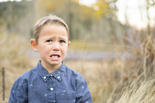 Wallpaper Mural Little boy outdoors crying Torontodigital.ca