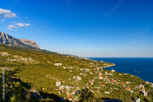 view of the Black Sea city of Foros from the height of the mountain, on a bright sunny cloudless day.