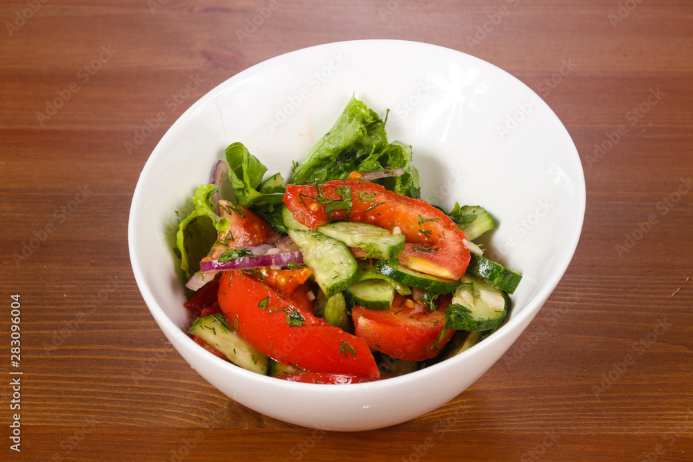 Vegetable salad with tomato, cucumbers Vegetable salad with tomato, cucumbers