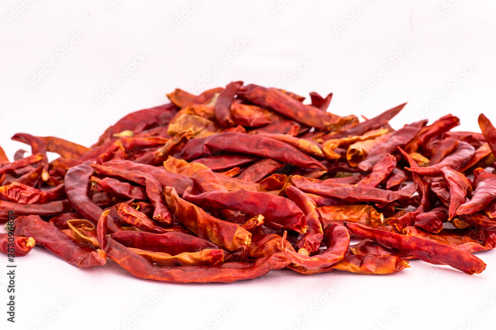 Fototapeta premium Dried red chili or chilli cayenne pepper isolated on white background